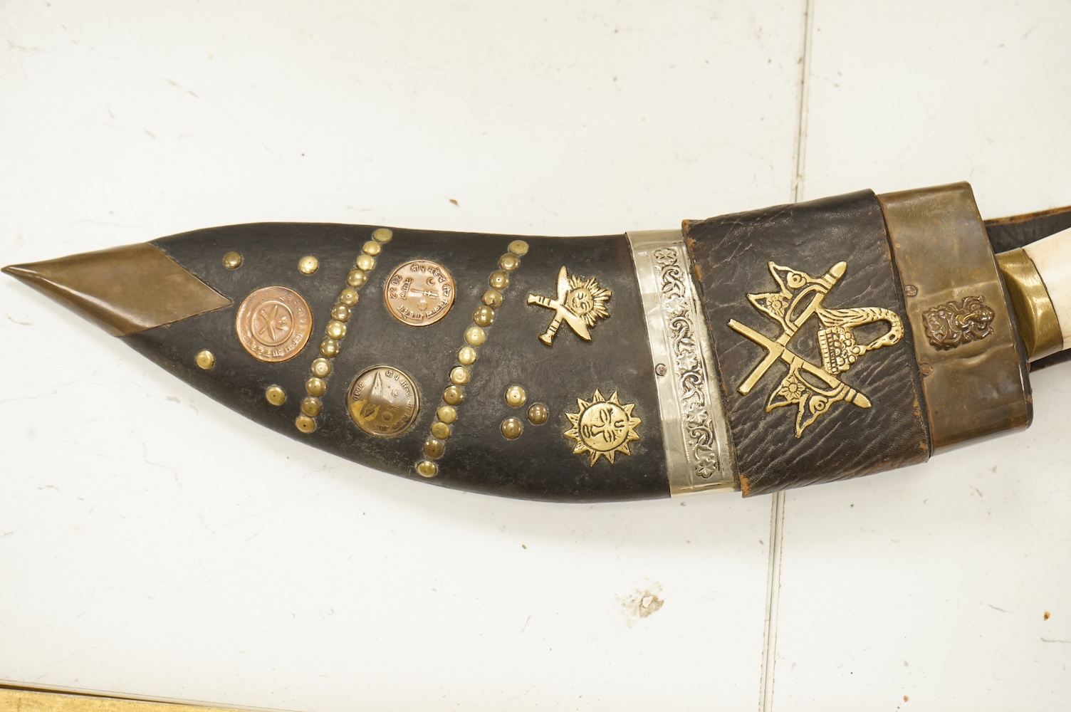 A bone handled Kukri knife, in mounted sheath